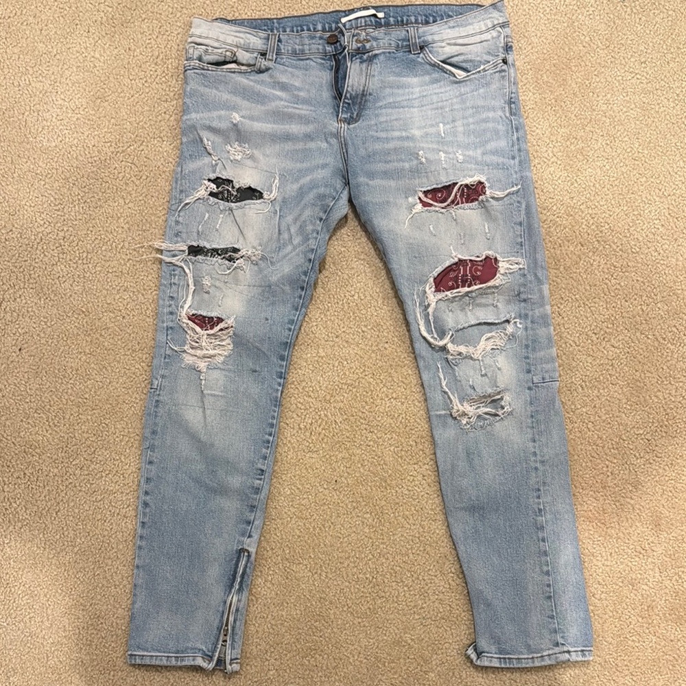 Distressed Light Blue Jeans with Red Accents